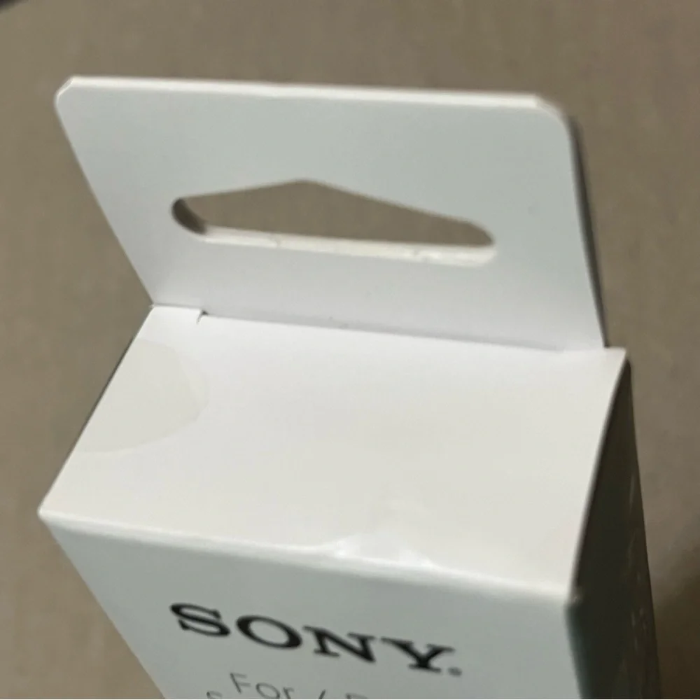 Sony white EX series earbud stereo headset w/ mic Y cable/slider L shape plug.
